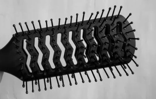 WHAT IS THAT GREY LINT ON YOUR HAIRBRUSH?