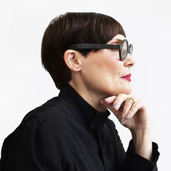 side profile of founder Mary Futher with short hair and round glasses